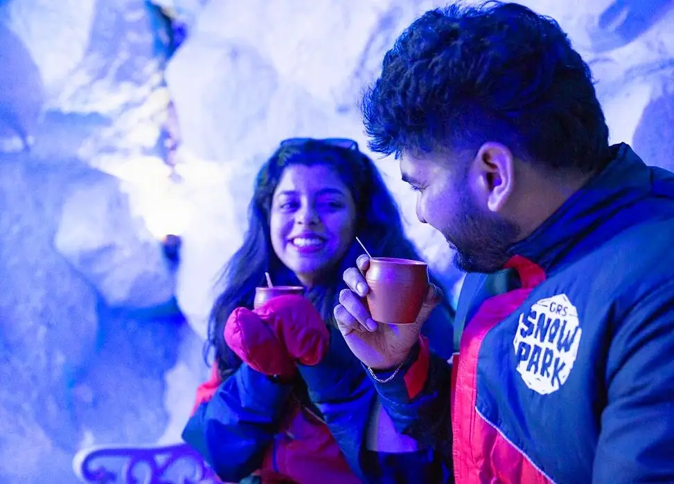Couple enjoying snowfall at GRS Snow Park