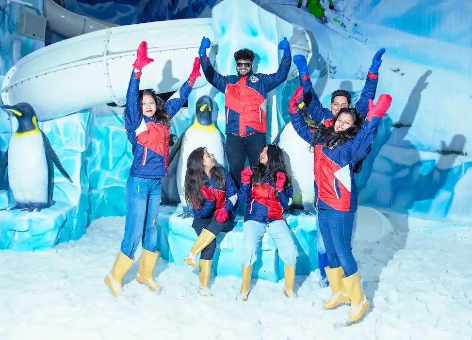 Friends celebrating in snow at GRS Snow Park